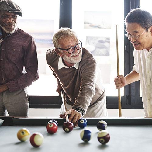 Social club members playing billiards