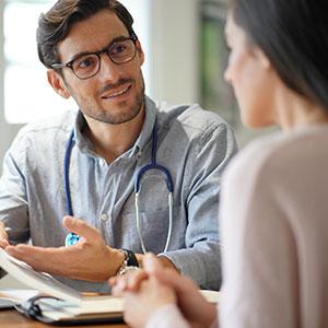 Doctor speaking to patient