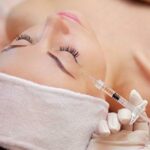 Woman receiving injectable cosmetic treatment
