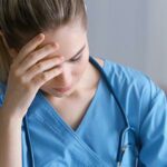 Nurse holding head