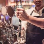 Barman pulling a pint