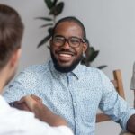 Man shaking hands in interview