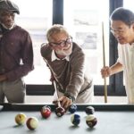 Social club members playing billiards