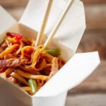 Takeaway meal with chopsticks