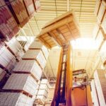 Forklift moving a pallete in a warehouse