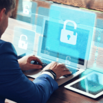 Man using laptop with padlock icon on screen